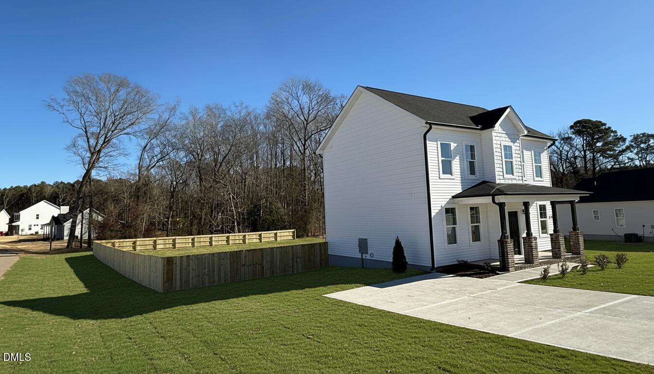 200 Longbow Drive Middlesex, NC 27557 - Photo 1 of 14 a front view of a house with a yard