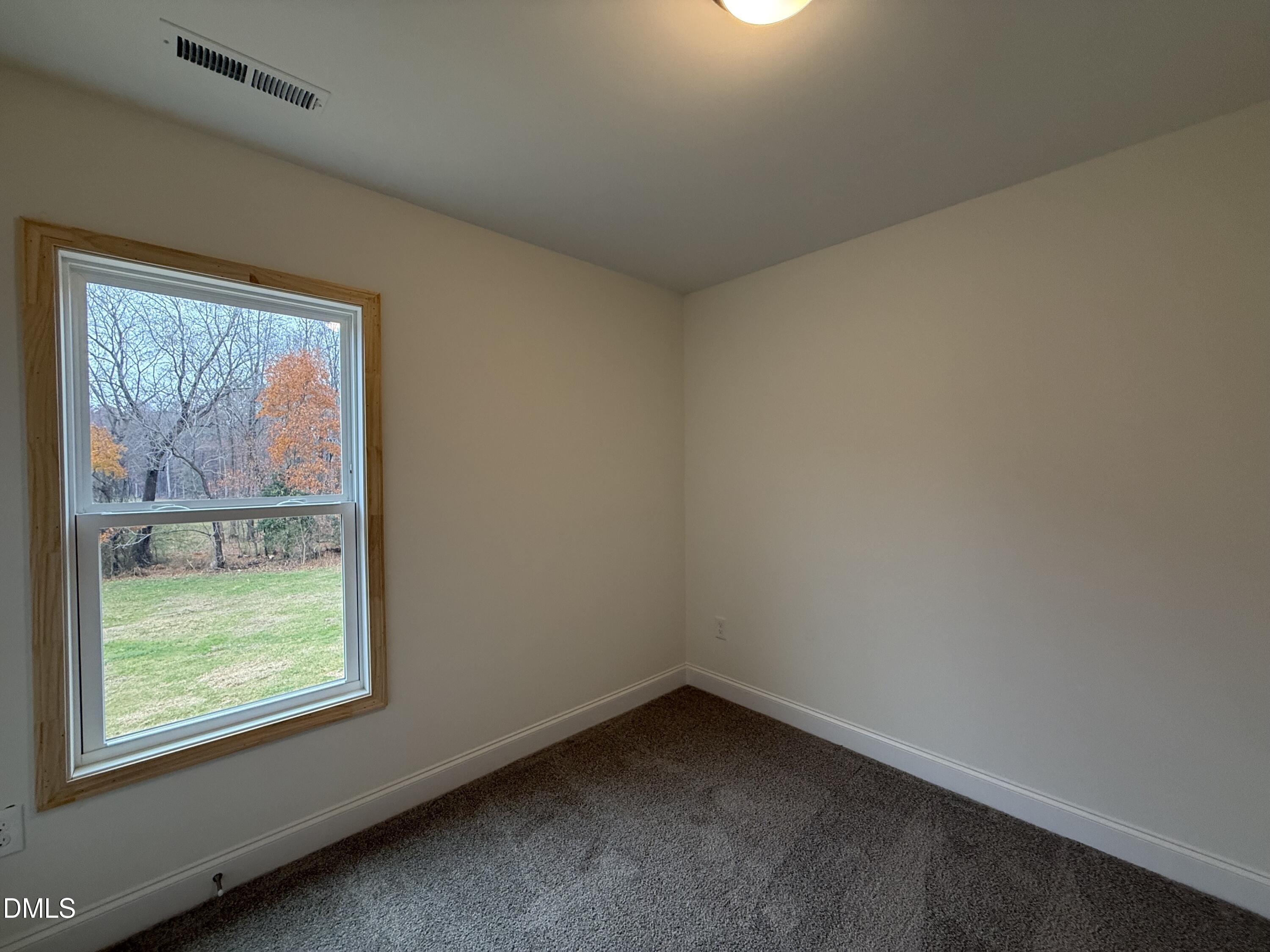 200 Longbow Drive Middlesex, NC 27557 - Photo 11 of 14 an empty room with a window