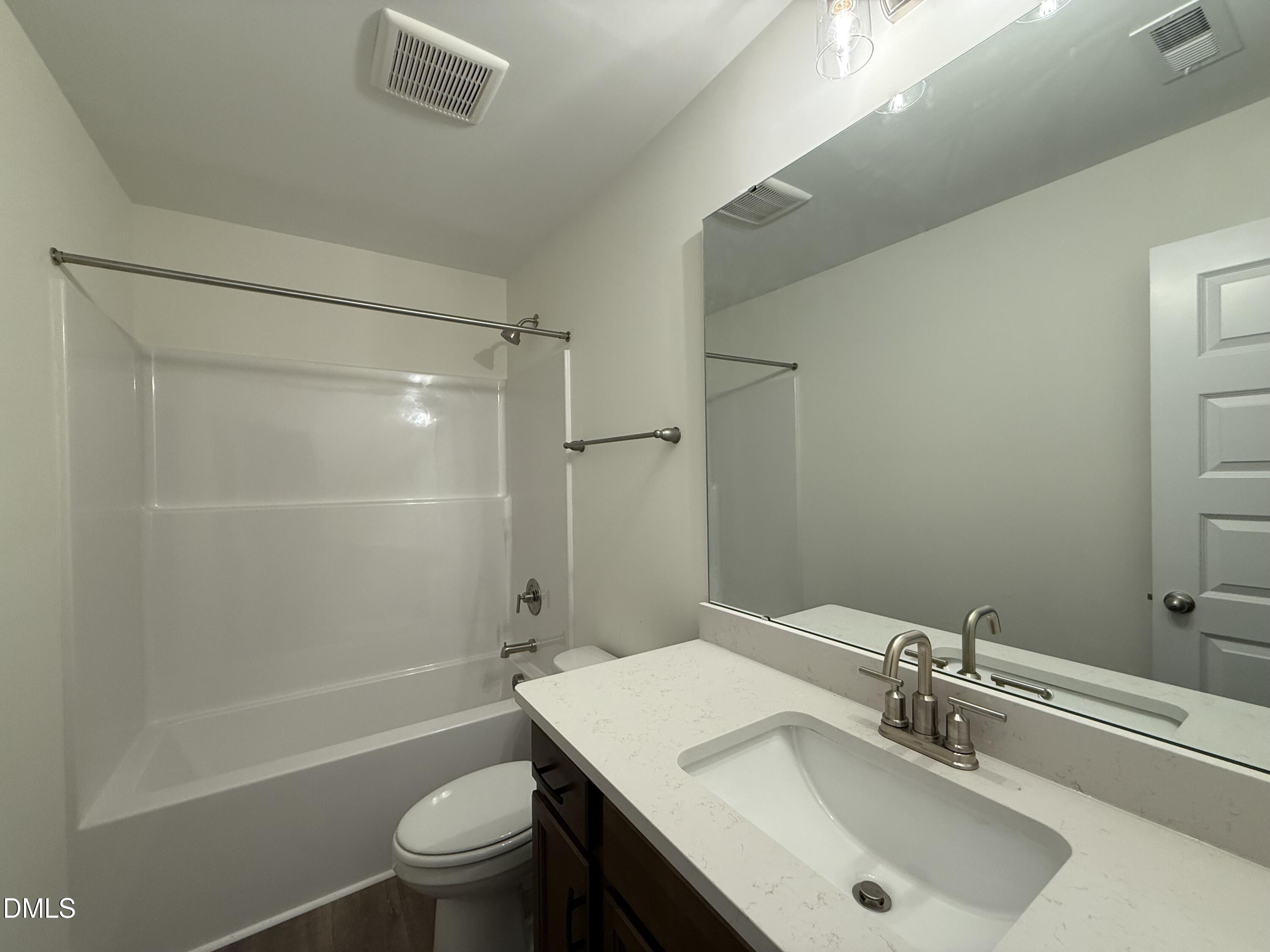 200 Longbow Drive Middlesex, NC 27557 - Photo 12 of 14 a bathroom with a sink a toilet and shower