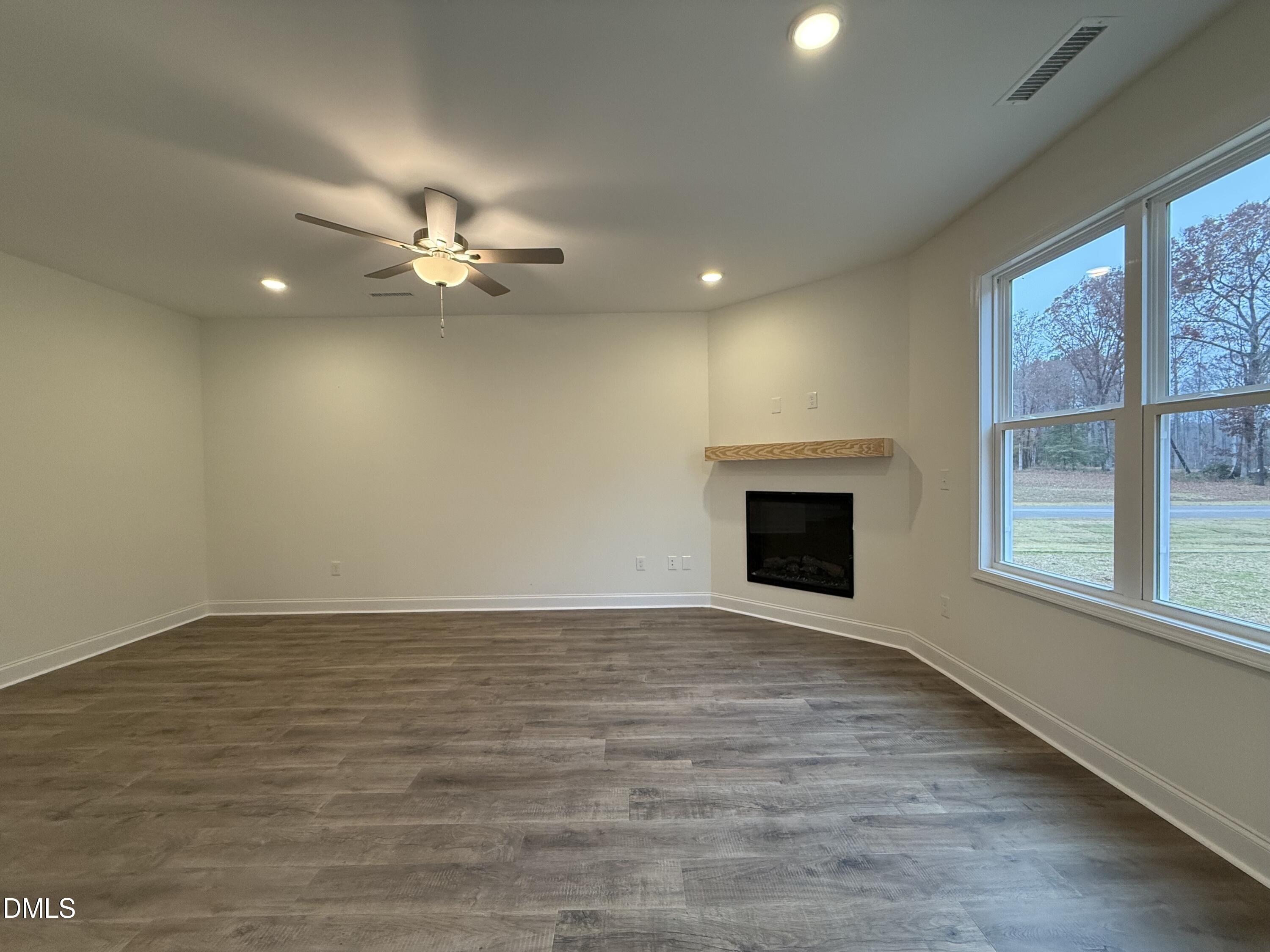 200 Longbow Drive Middlesex, NC 27557 - Photo 3 of 14 wooden floor in an empty room with a window