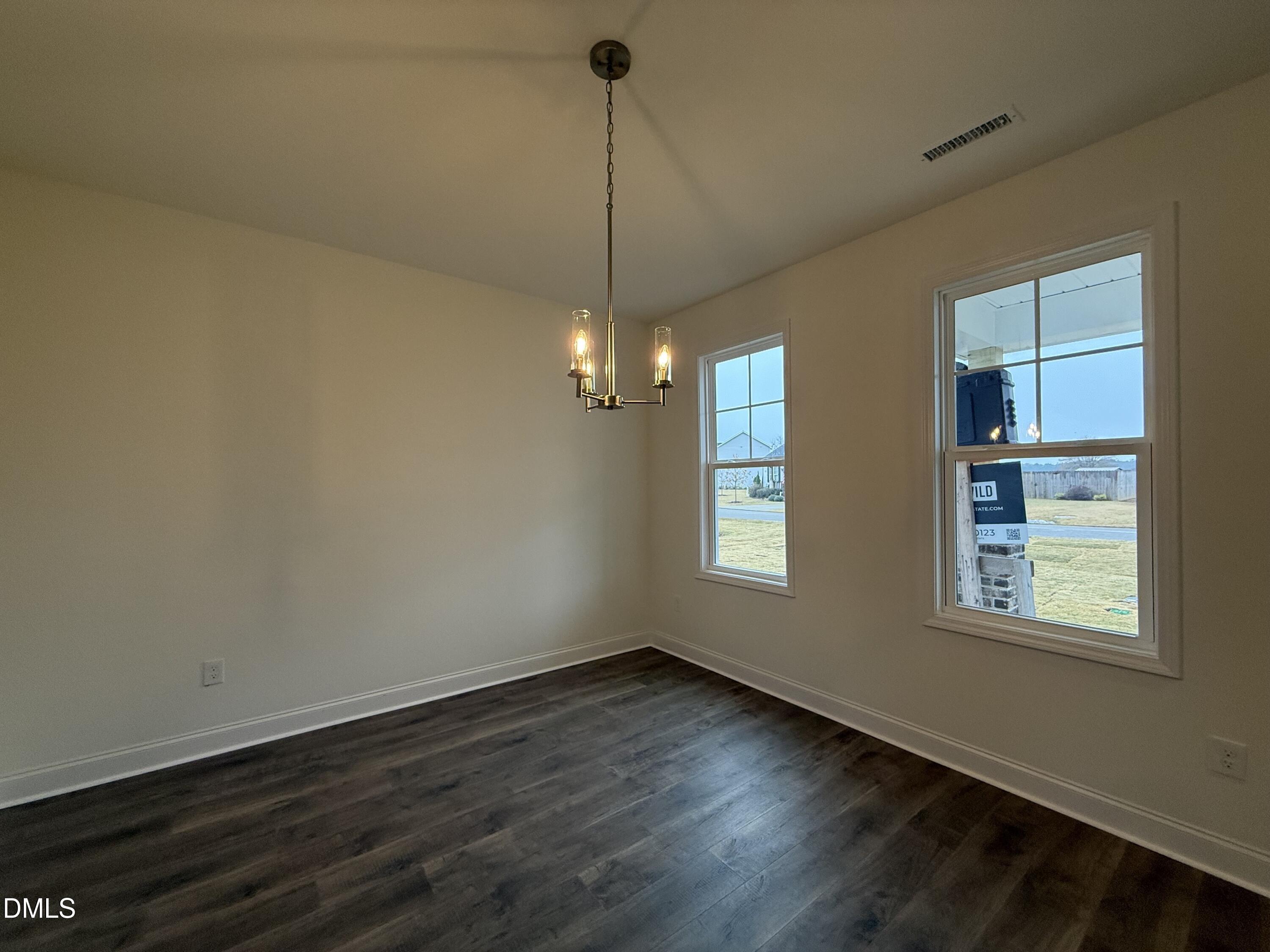 200 Longbow Drive Middlesex, NC 27557 - Photo 6 of 14 a view of a room with wooden floor ceiling fan and windows