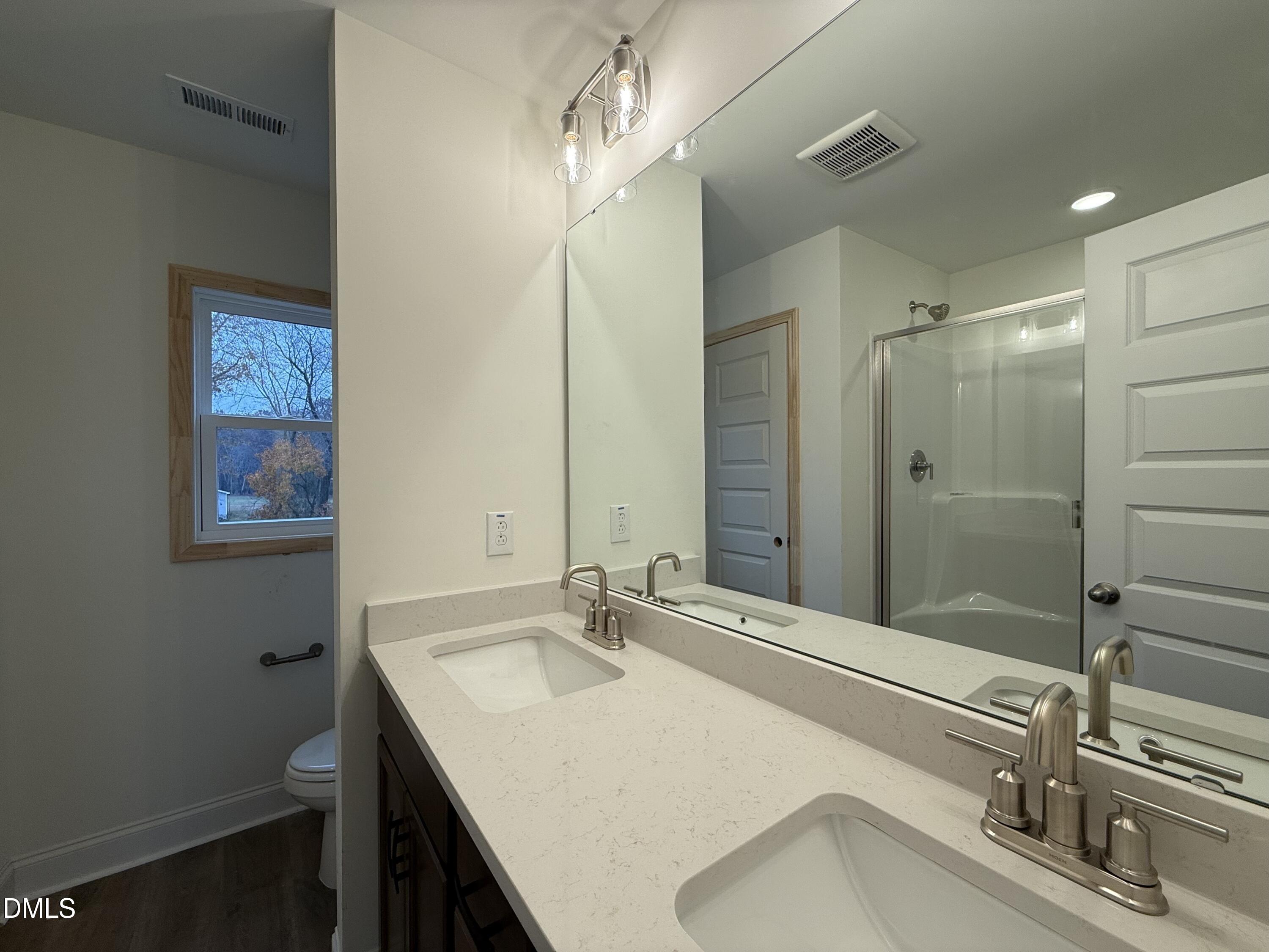 200 Longbow Drive Middlesex, NC 27557 - Photo 9 of 14 a bathroom with a sink and a mirror