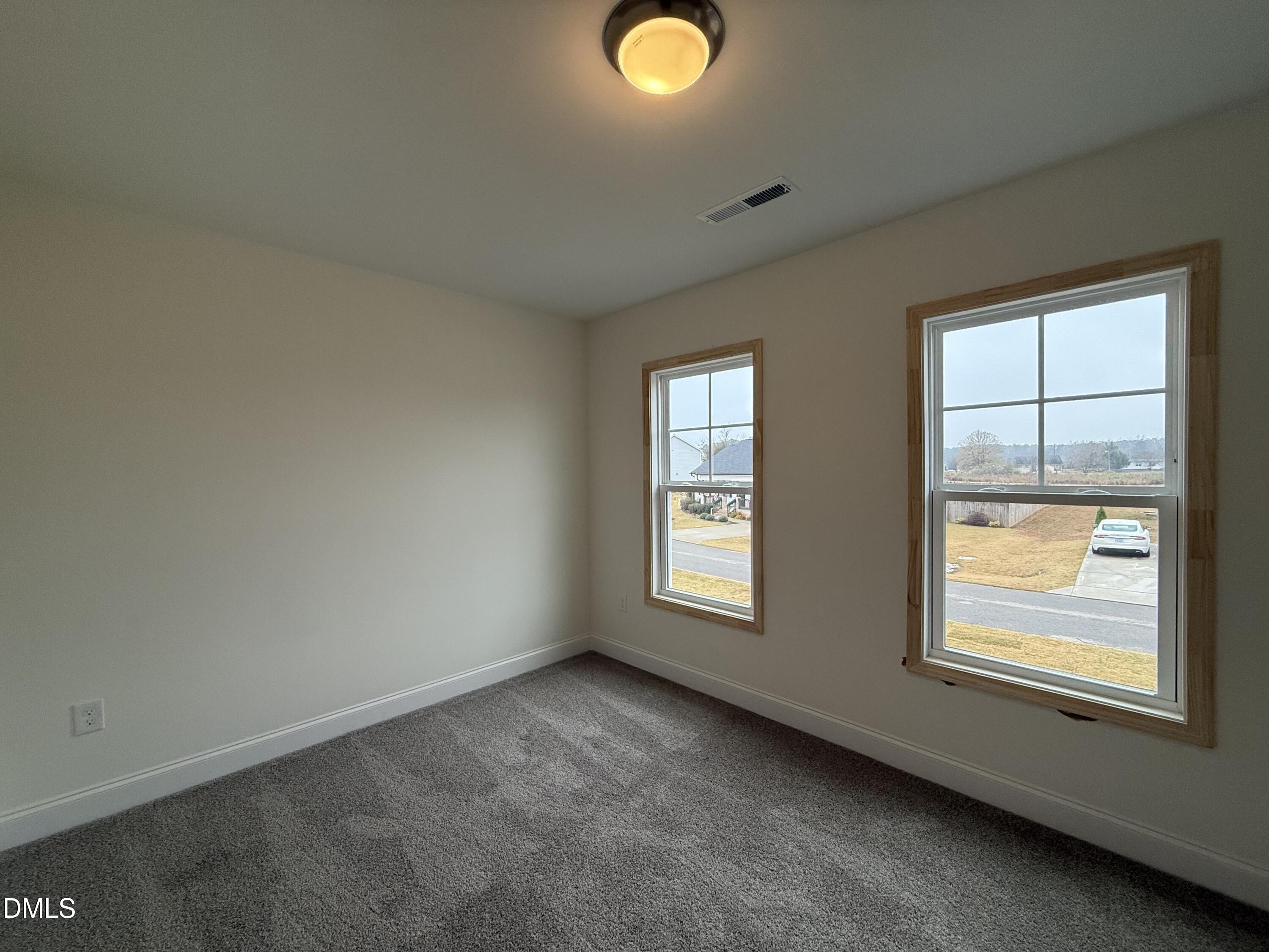 200 Longbow Drive Middlesex, NC 27557 - Photo 10 of 14 an empty room with windows and mirror