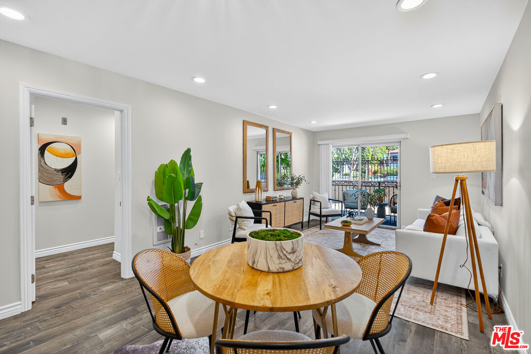 1125 Pico Boulevard, Unit 103 Santa Monica, CA 90405 - Photo 12 of 34 a living room with furniture and a wooden floor