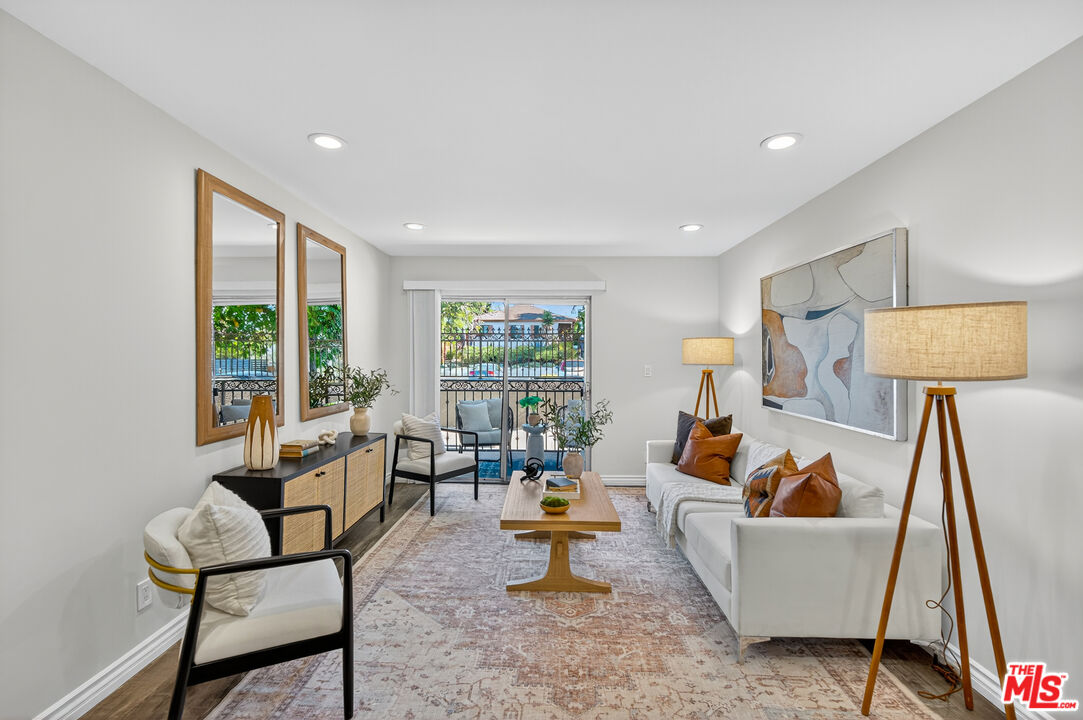 1125 Pico Boulevard, Unit 103 Santa Monica, CA 90405 - Photo 13 of 34 a living room with furniture and a window