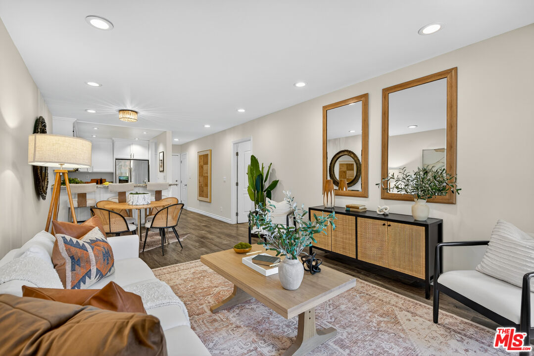 1125 Pico Boulevard, Unit 103 Santa Monica, CA 90405 - Photo 15 of 34 a living room with furniture and a large window