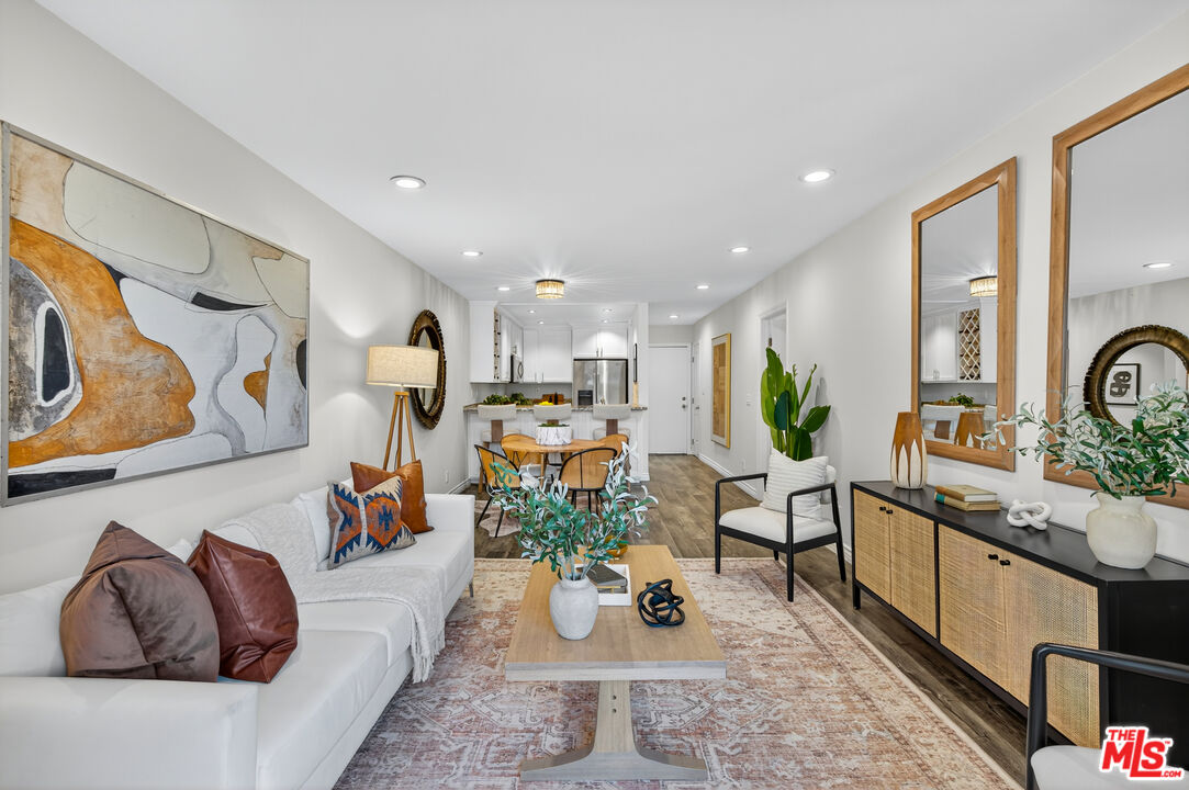 1125 Pico Boulevard, Unit 103 Santa Monica, CA 90405 - Photo 16 of 34 a living room with furniture appliances and a large window