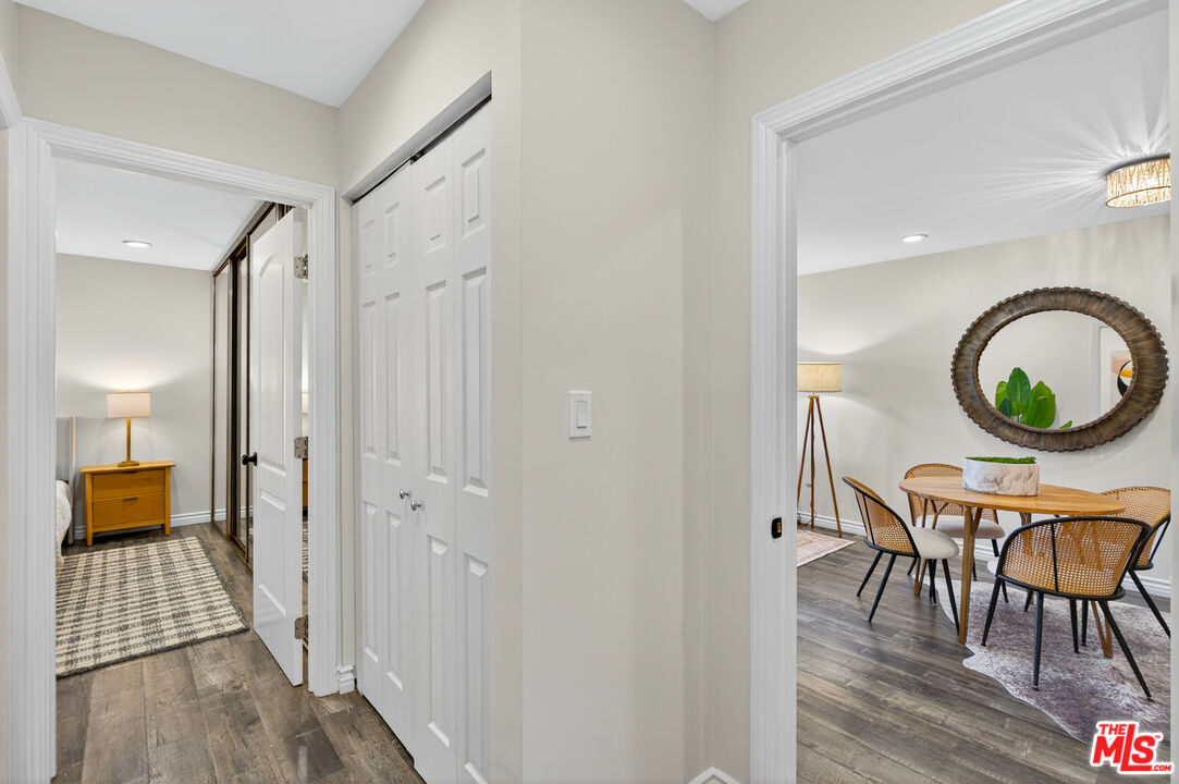1125 Pico Boulevard, Unit 103 Santa Monica, CA 90405 - Photo 17 of 34 a view of a hallway with furniture and wooden floor