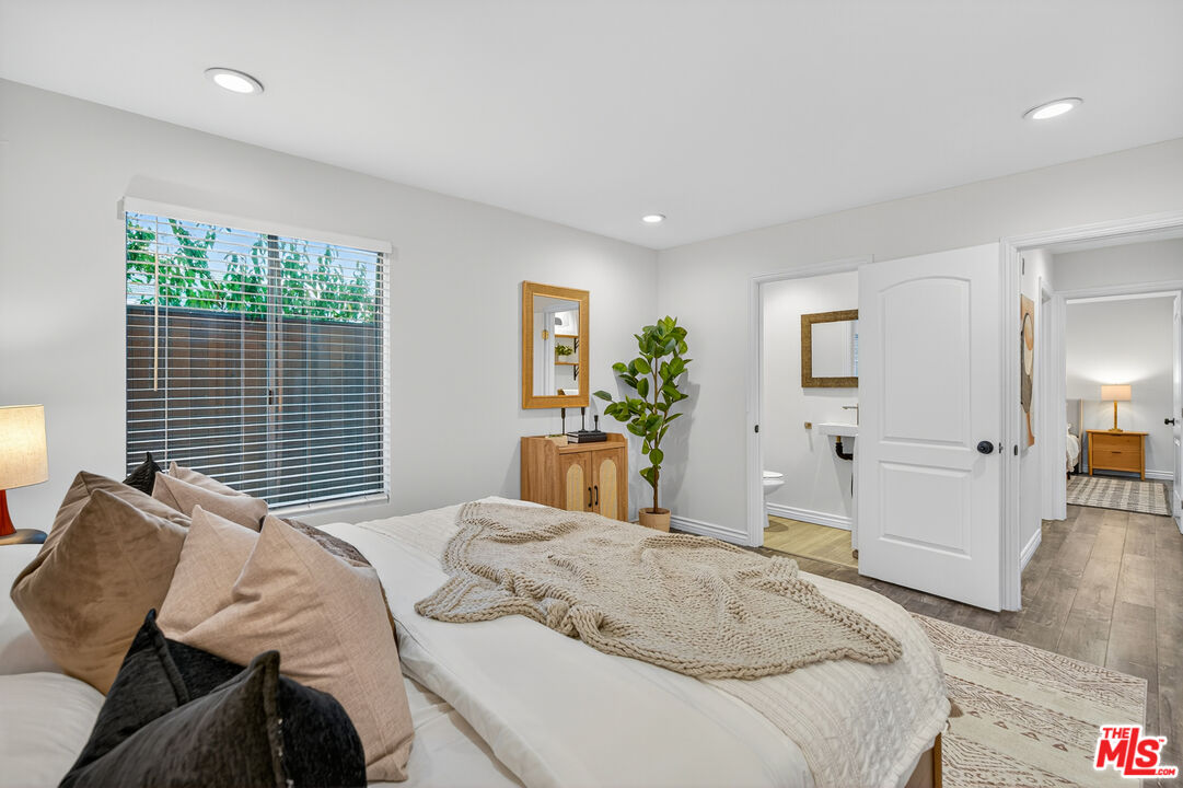 1125 Pico Boulevard, Unit 103 Santa Monica, CA 90405 - Photo 19 of 34 a bedroom with a bed and a large window