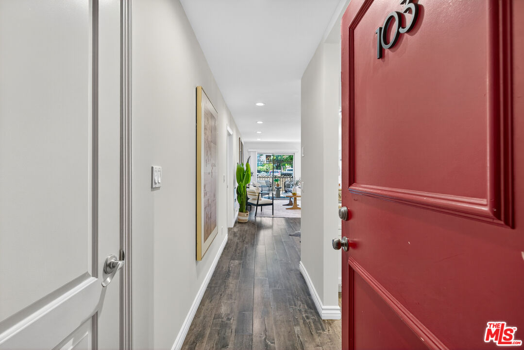 1125 Pico Boulevard, Unit 103 Santa Monica, CA 90405 - Photo 2 of 34 a view of a hallway with wooden floor and staircase