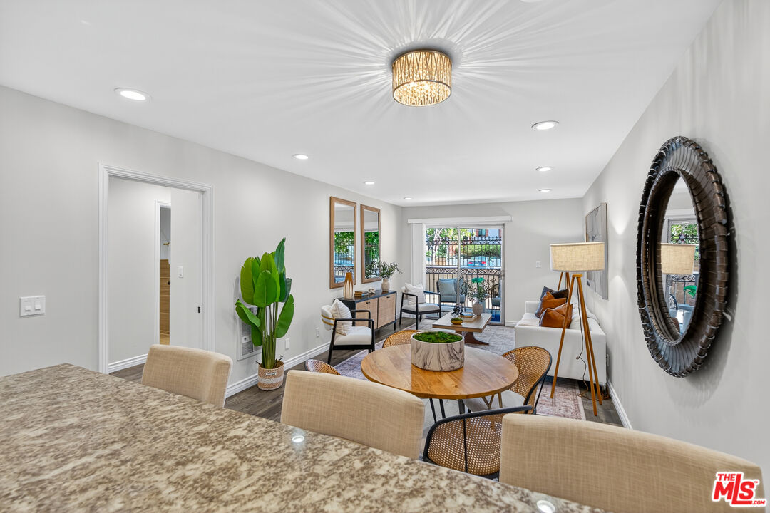 1125 Pico Boulevard, Unit 103 Santa Monica, CA 90405 - Photo 10 of 34 a living room with furniture a rug a window and a potted plant