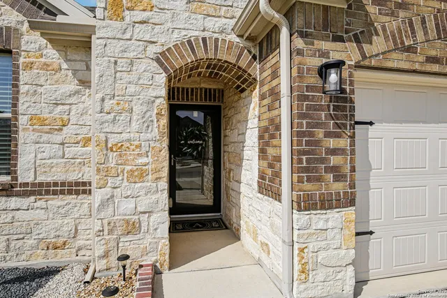 a living room with furniture and a flat screen tv with wooden floor