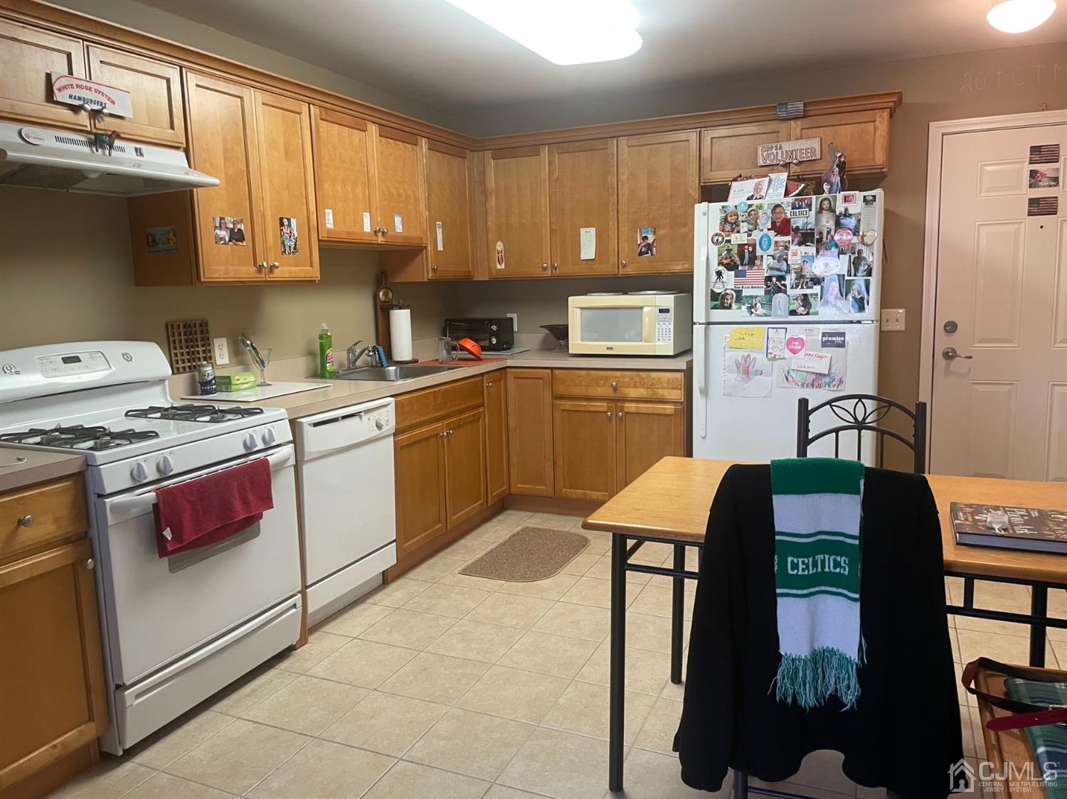 105 Liddle Avenue Edison, NJ 08837 - Photo 4 of 12 a kitchen that has a lot of cabinets a sink and a stove in it
