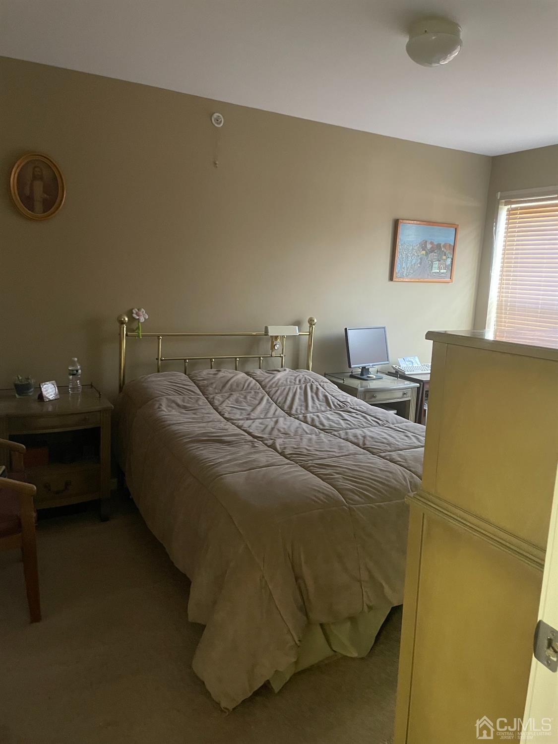 105 Liddle Avenue Edison, NJ 08837 - Photo 6 of 12 a bedroom with a bed and a window