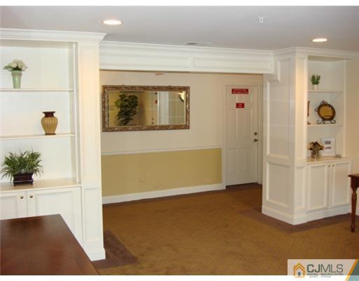105 Liddle Avenue Edison, NJ 08837 - Photo 7 of 12 a view of a hallway to a bedroom and front door