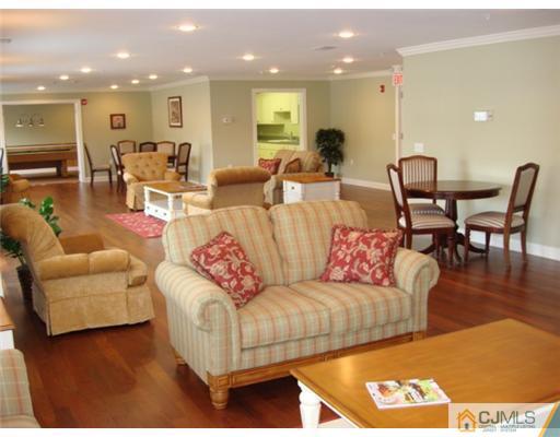 105 Liddle Avenue Edison, NJ 08837 - Photo 9 of 12 a living room with furniture kitchen view and a dining table