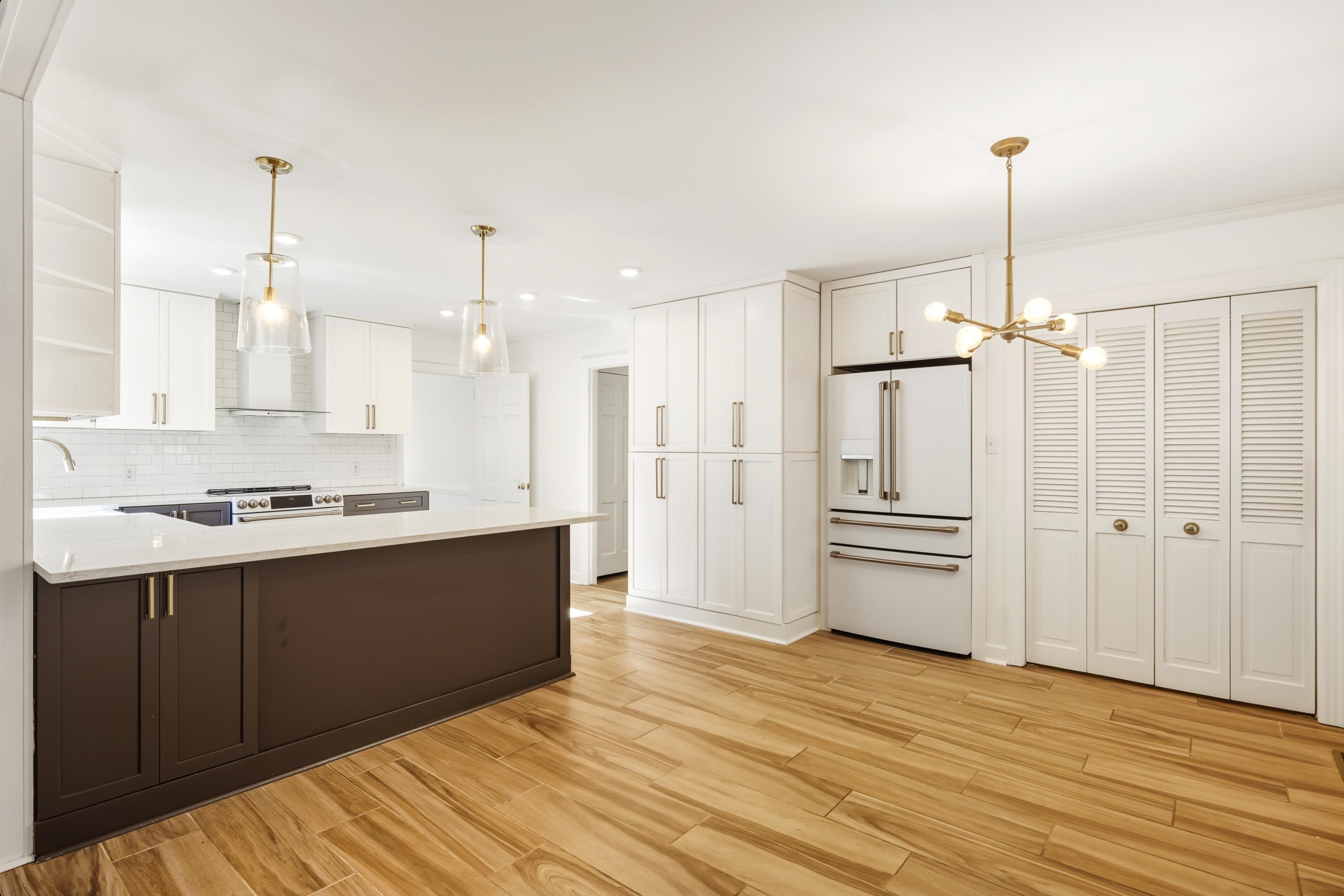 126 Rooks Drive Brownsville, TN 38012 - Photo 12 of 37 a view of a kitchen with wooden floor and a kitchen