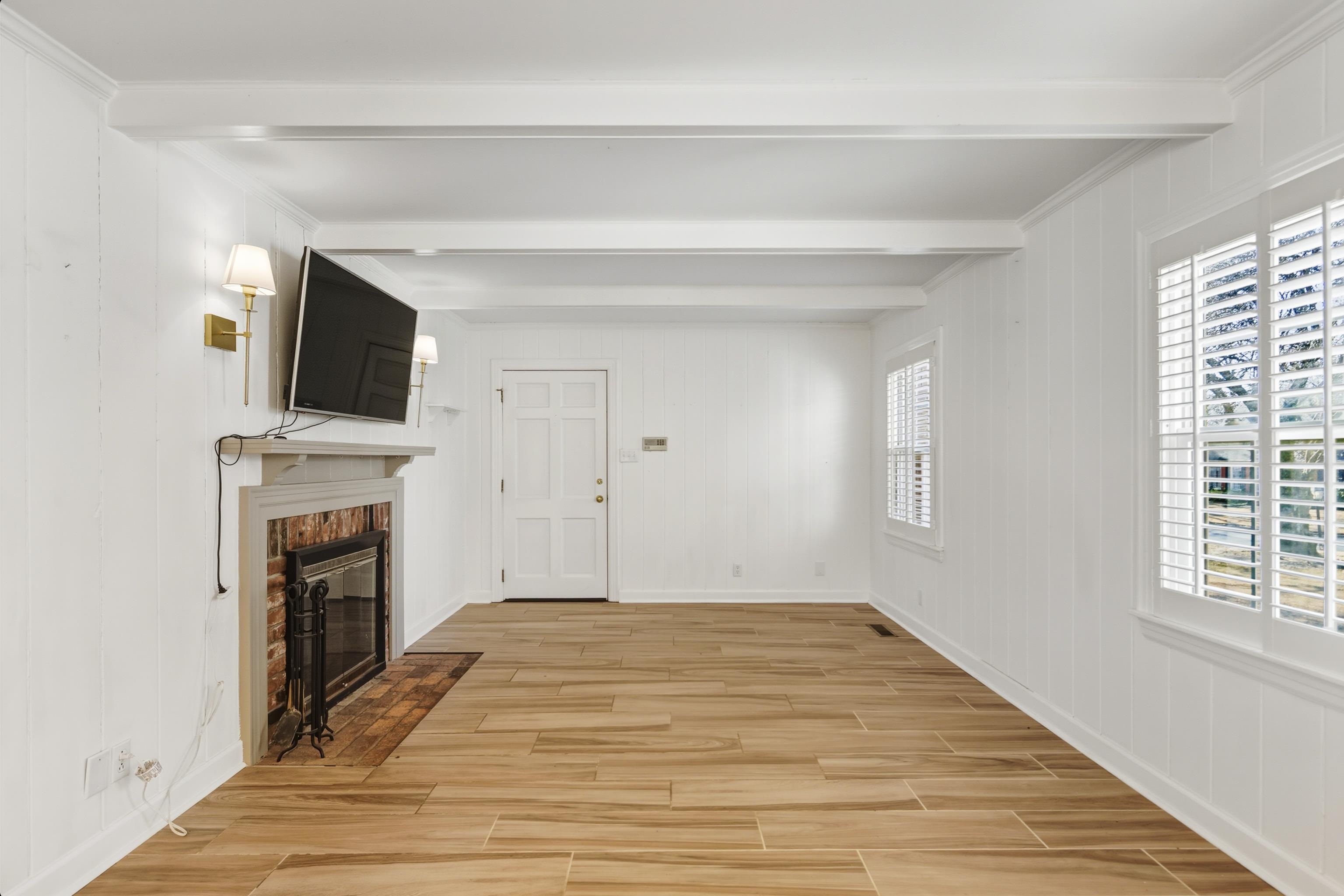 126 Rooks Drive Brownsville, TN 38012 - Photo 14 of 37 a view of a livingroom with a fireplace and window