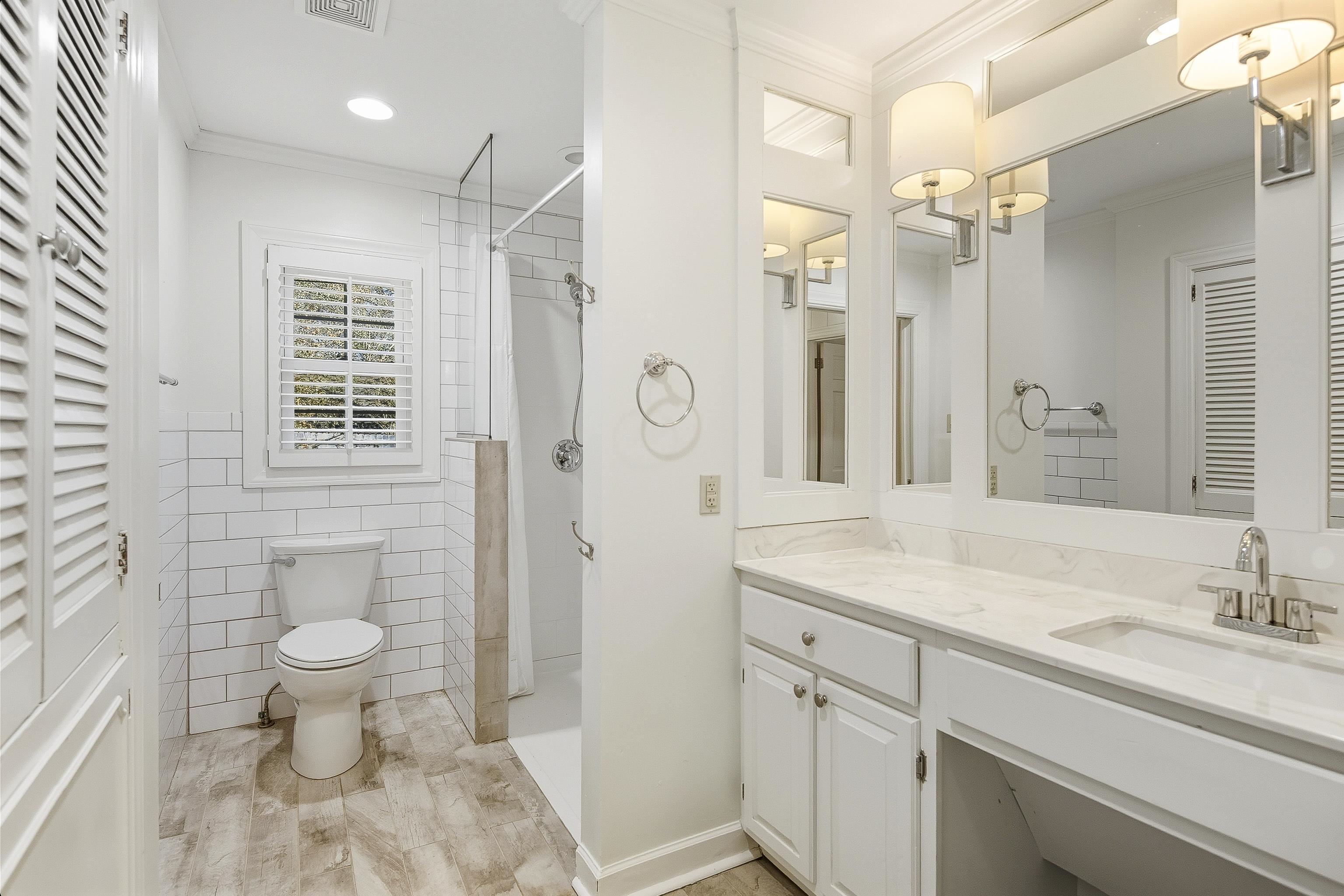 126 Rooks Drive Brownsville, TN 38012 - Photo 18 of 37 a bathroom with a sink a toilet a mirror and shower