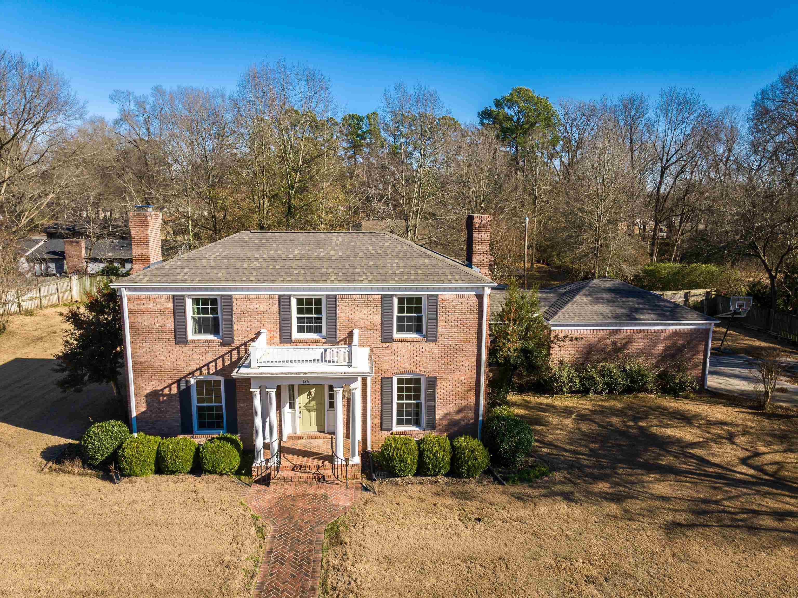 126 Rooks Drive Brownsville, TN 38012 - Photo 2 of 37 a front view of a house with a garden