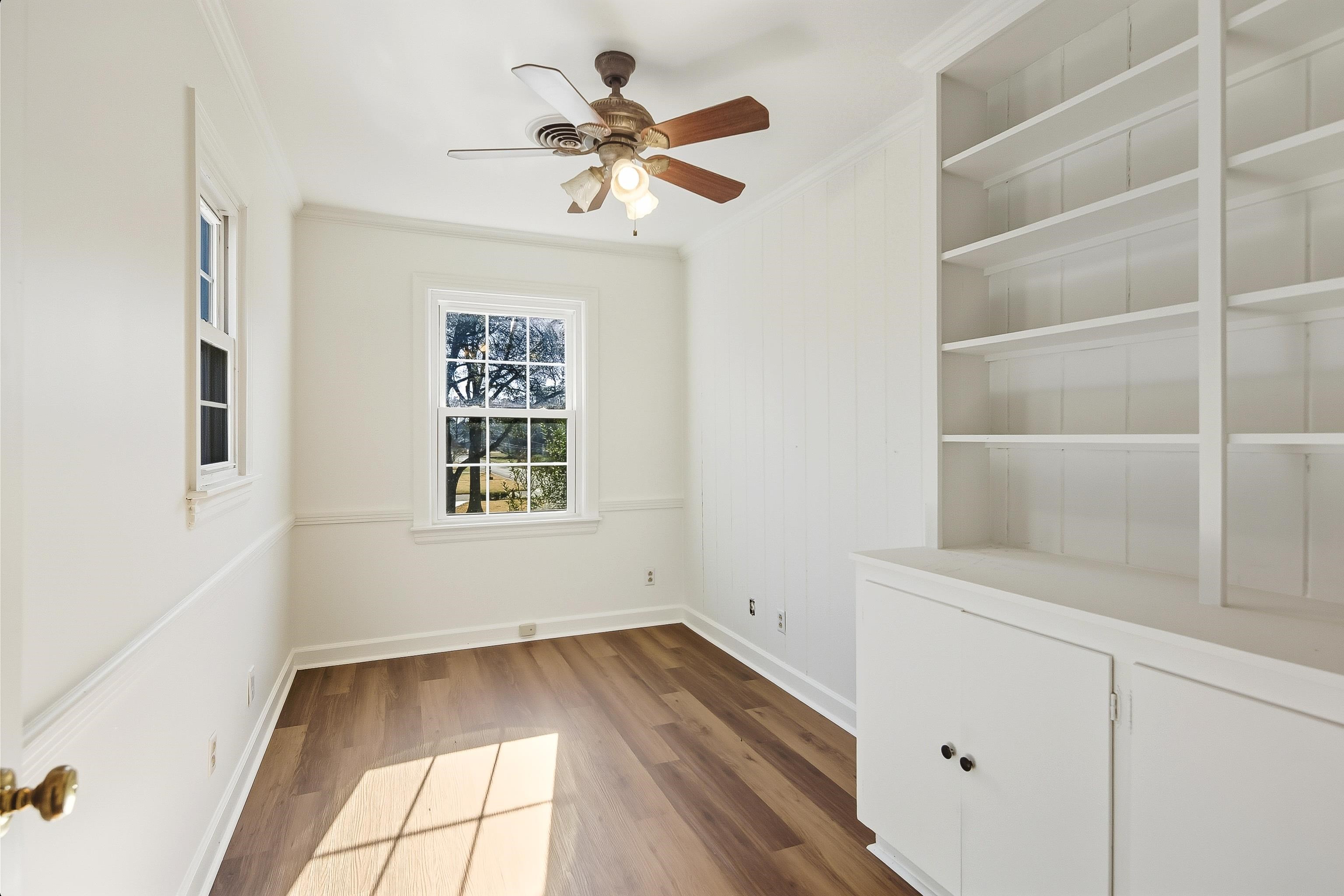 126 Rooks Drive Brownsville, TN 38012 - Photo 22 of 37 a view of room with a window and a ceiling fan