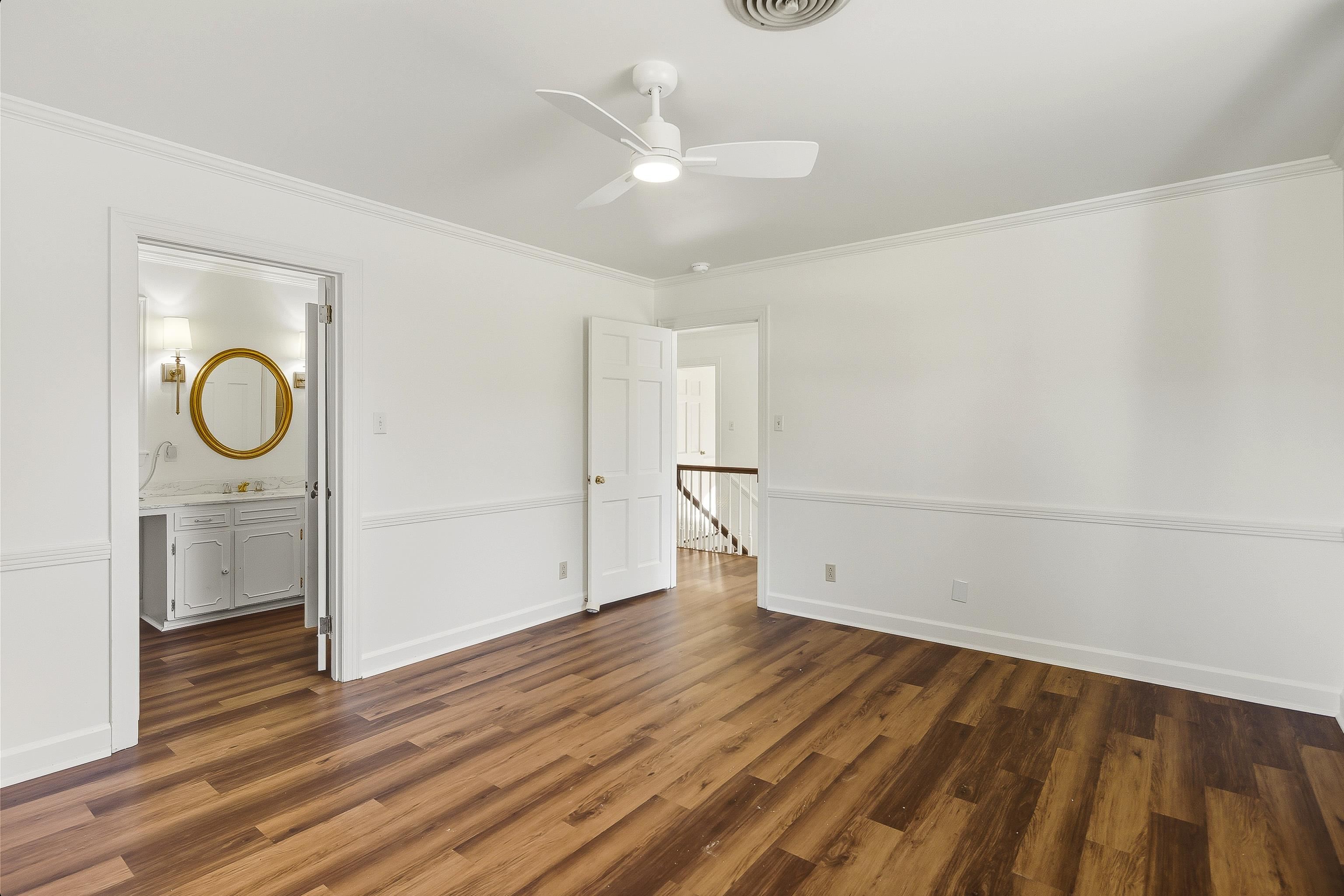 126 Rooks Drive Brownsville, TN 38012 - Photo 25 of 37 a view of empty room with wooden floor and fan