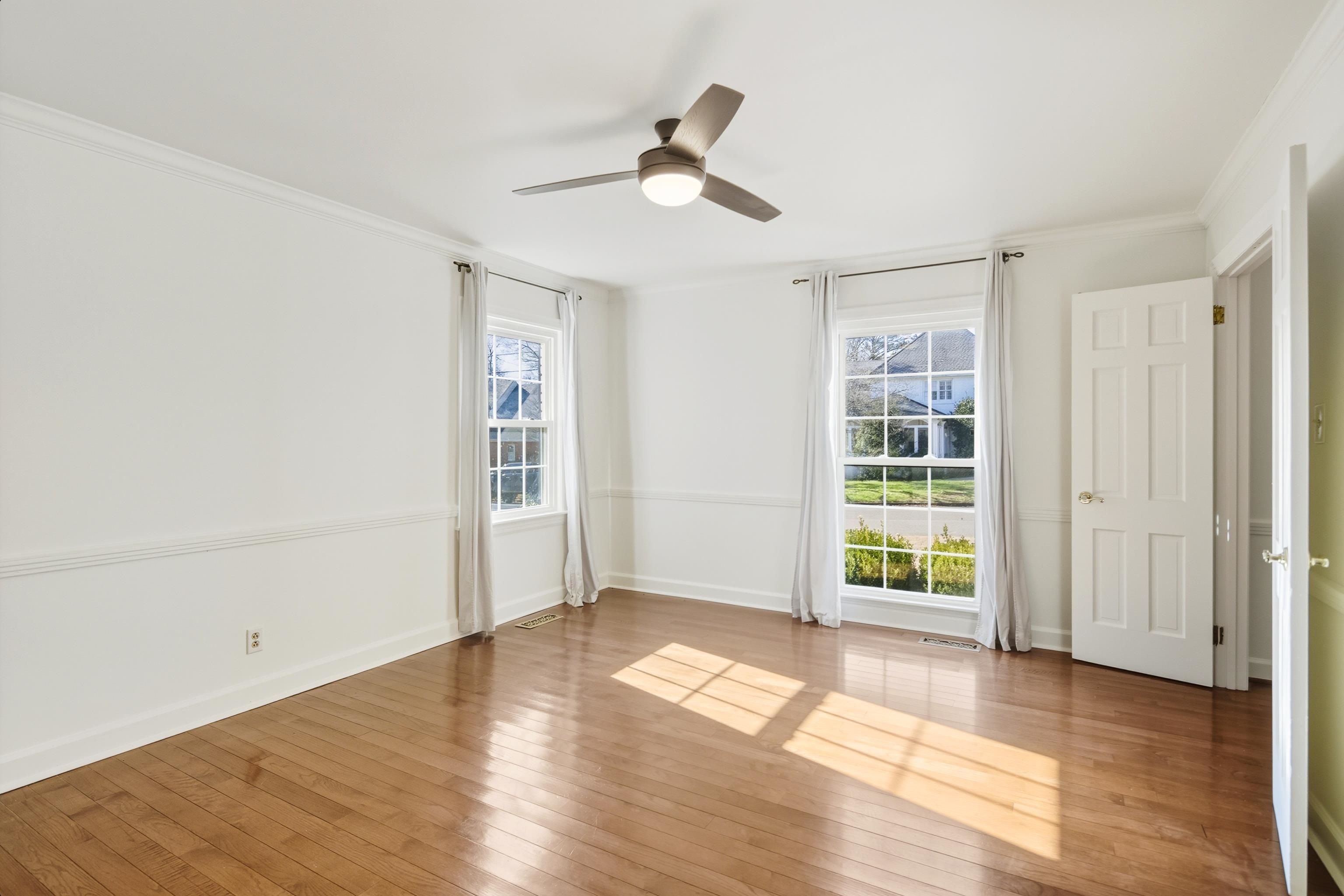 126 Rooks Drive Brownsville, TN 38012 - Photo 8 of 37 wooden floor in an empty room with a window
