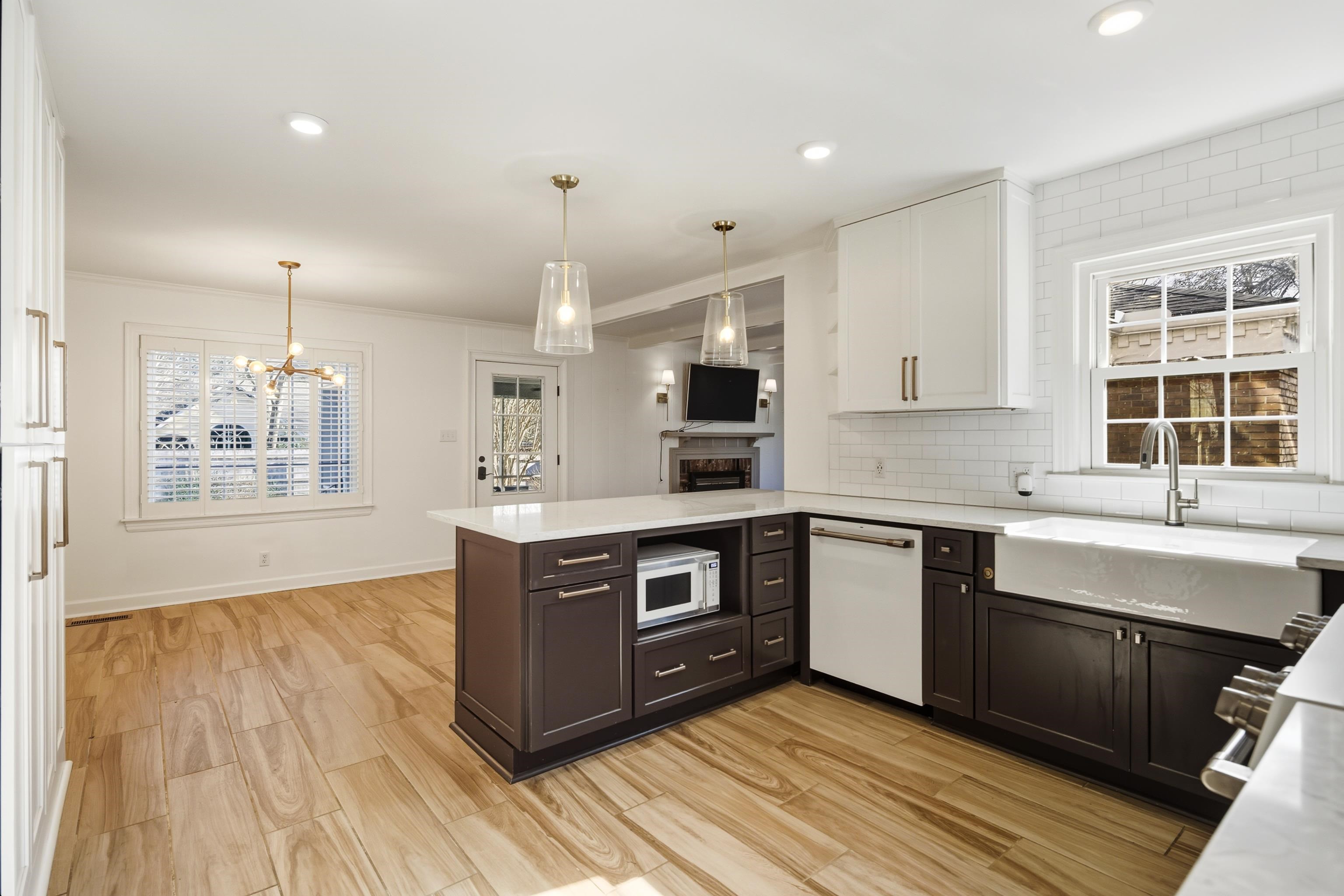 126 Rooks Drive Brownsville, TN 38012 - Photo 9 of 37 a kitchen with stainless steel appliances granite countertop a sink a stove and a wooden floors