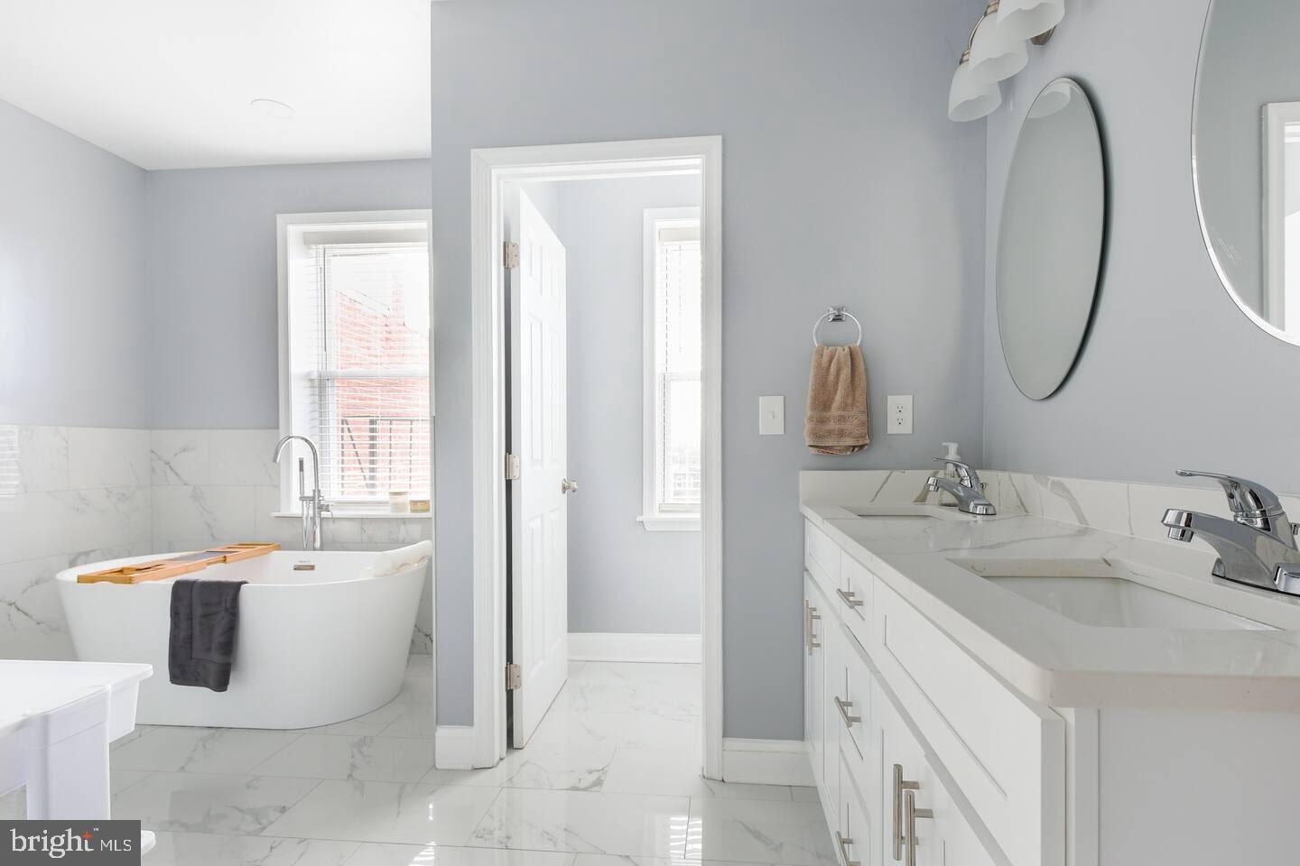 5 East 27th Street Baltimore, MD 21218 - Photo 11 of 34 a bathroom with a sink and a mirror
