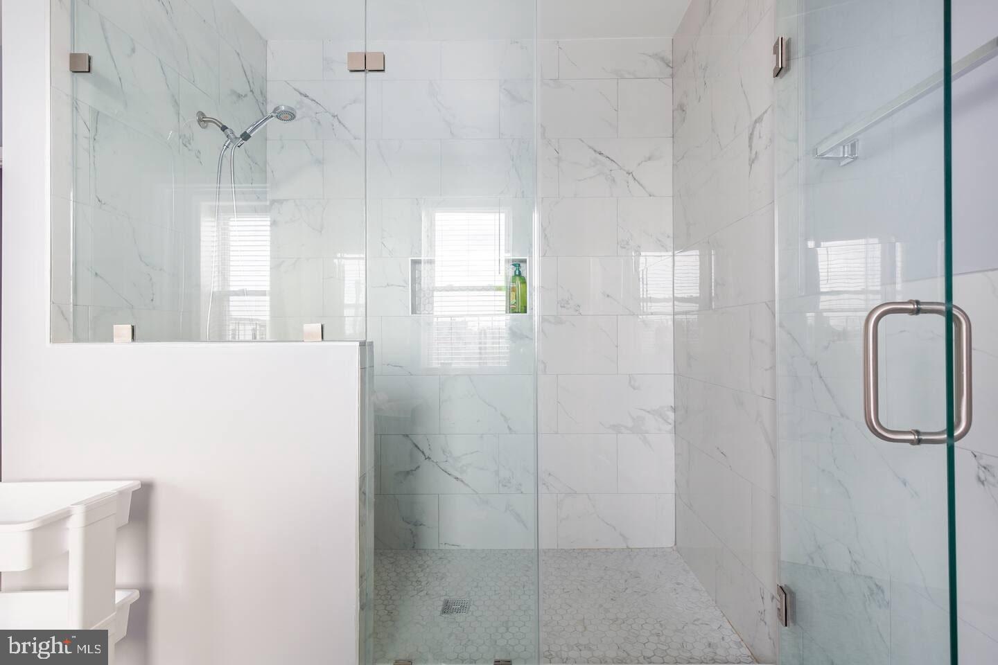 5 East 27th Street Baltimore, MD 21218 - Photo 17 of 34 a bathroom with a shower