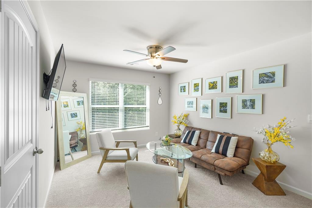 499 Walnut Grv Way Pendergrass, GA 30567 - Photo 15 of 19 a living room with furniture fireplace and a flat screen tv