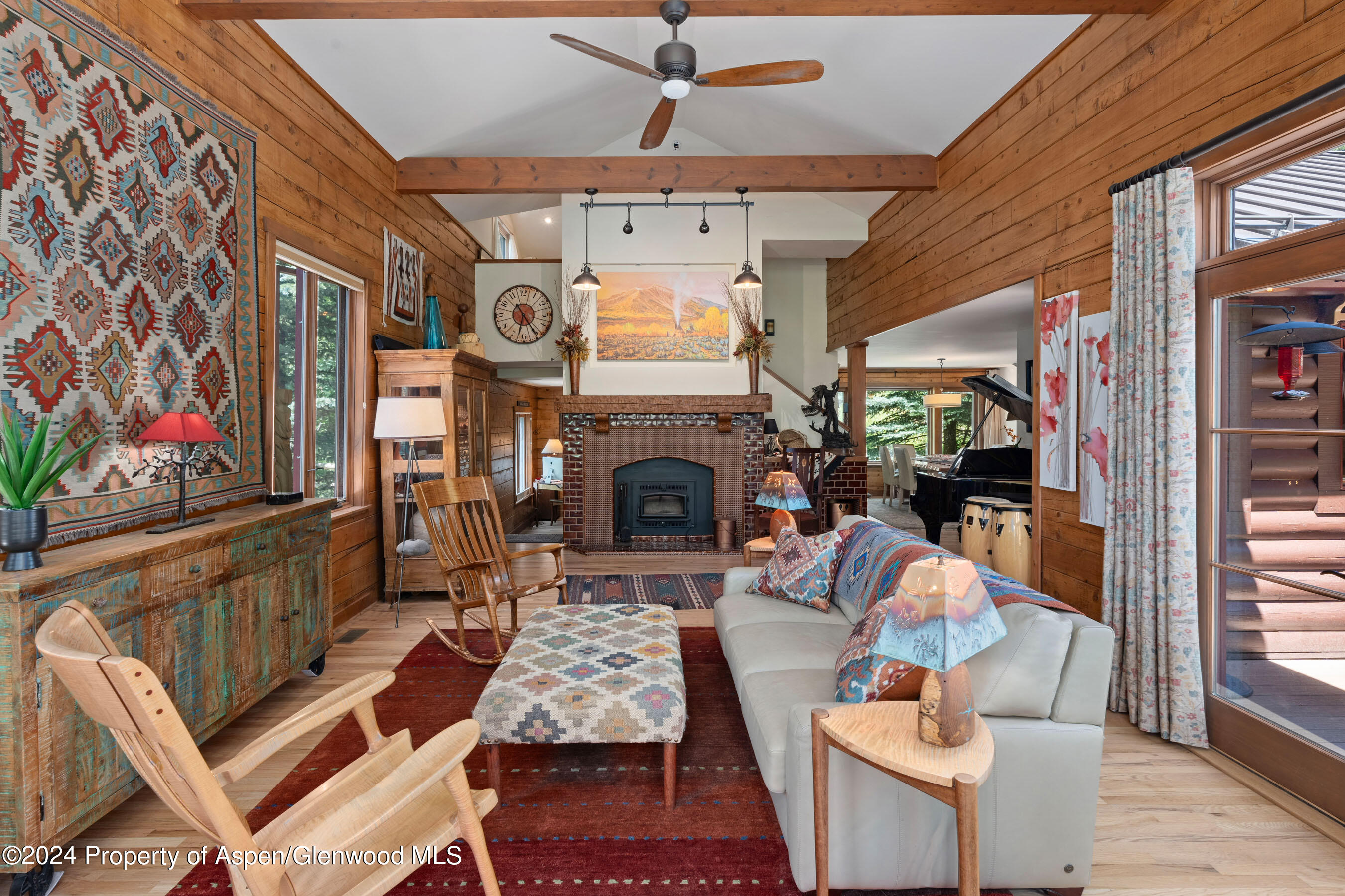 389 Elk Mountain Drive Redstone, CO 81623 - Photo 41 of 64 a living room with furniture a fireplace and a flat screen tv