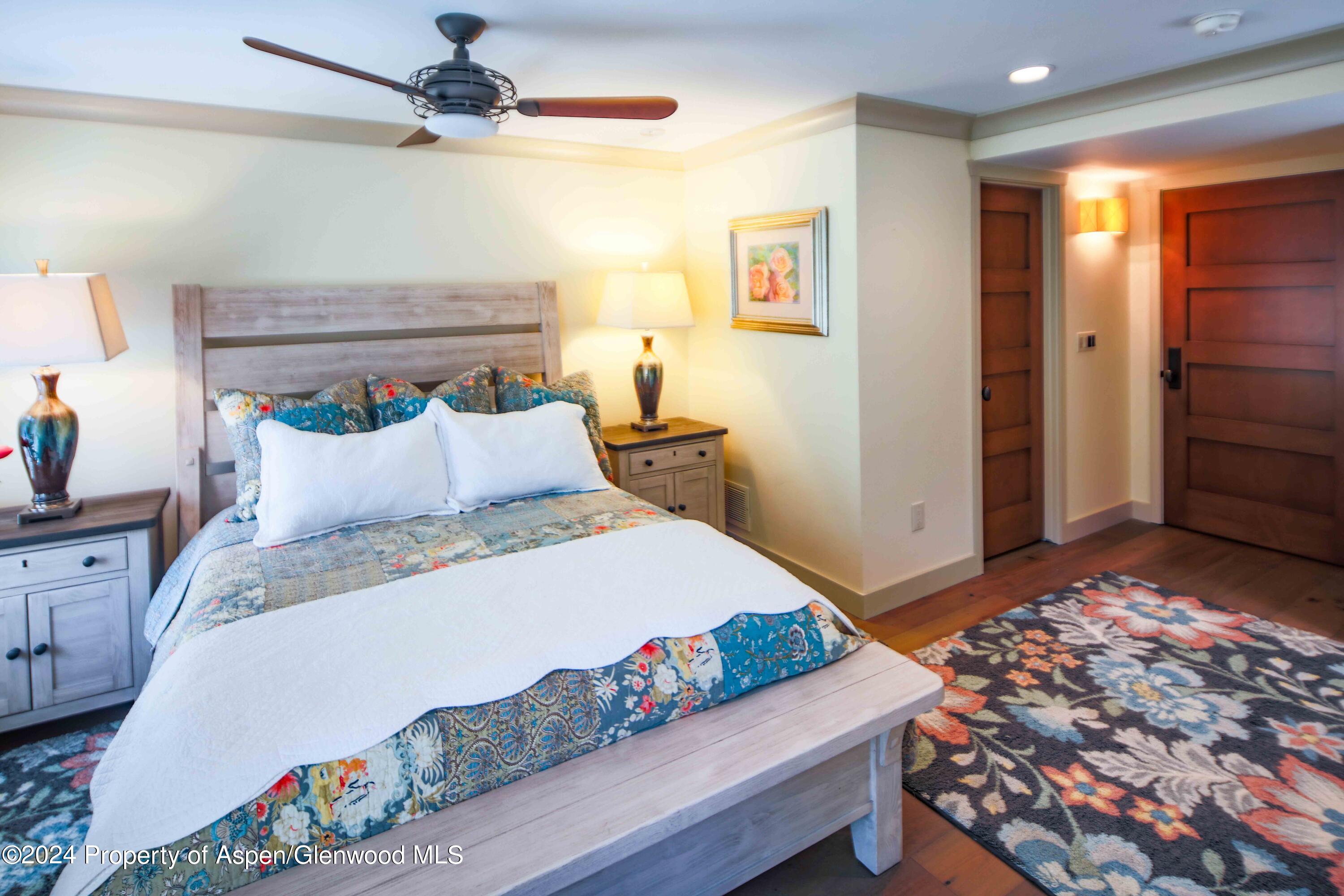 389 Elk Mountain Drive Redstone, CO 81623 - Photo 54 of 64 a bedroom with a bed and a dresser