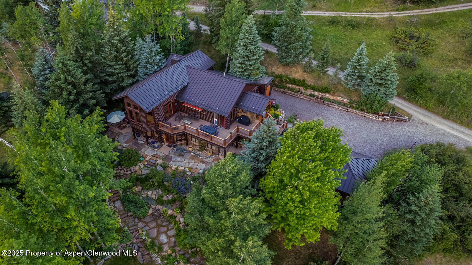 389 Elk Mountain Drive Redstone, CO 81623 - Photo 8 of 64 an aerial view of a house with garden space and street view