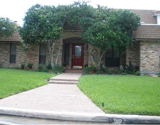 7026 Brandon Drive Corpus Christi, TX 78413 - Photo 1 of 10 front view of a house with a yard