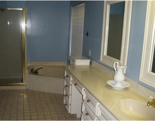 7026 Brandon Drive Corpus Christi, TX 78413 - Photo 9 of 10 a bathroom with a tub sink and mirror
