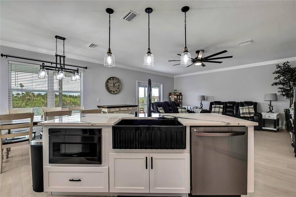 3276 Sea Grape Drive Hernando Beach, FL 34607 - Photo 15 of 55 a kitchen with stainless steel appliances granite countertop a sink and a stove