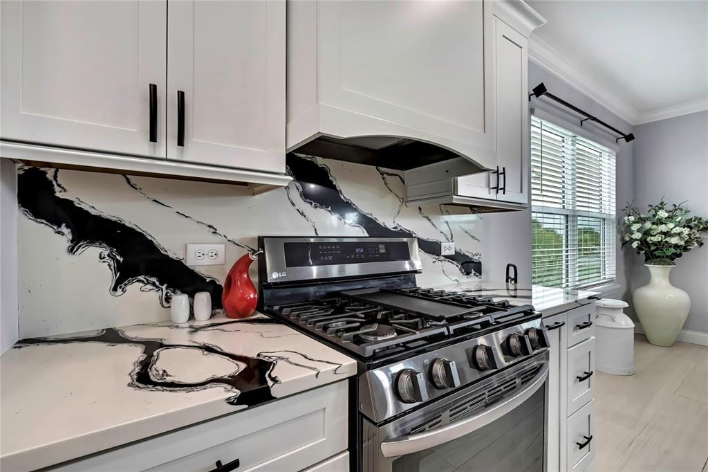3276 Sea Grape Drive Hernando Beach, FL 34607 - Photo 16 of 55 a stove top oven sitting inside of a kitchen