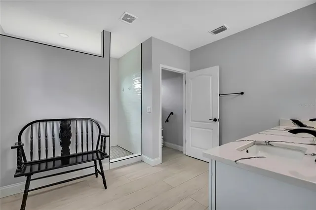 a bathroom with a toilet a sink and a window