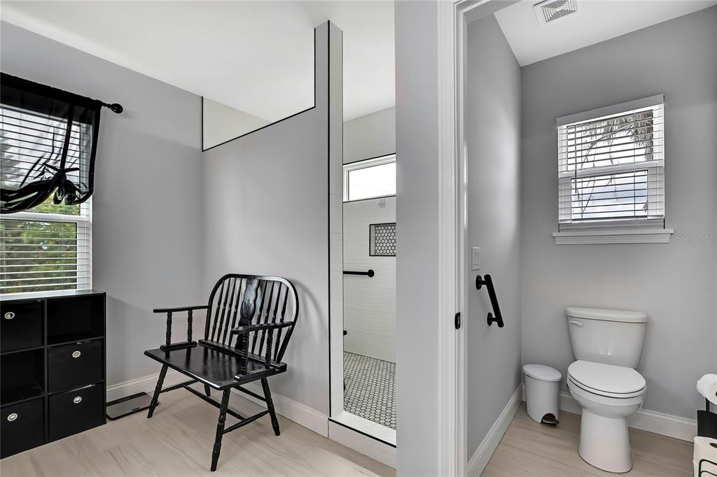 3276 Sea Grape Drive Hernando Beach, FL 34607 - Photo 21 of 55 a bathroom with a toilet a sink and a window