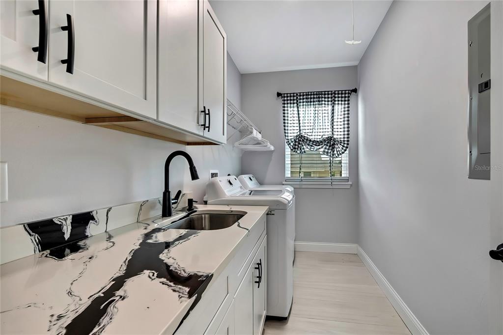 3276 Sea Grape Drive Hernando Beach, FL 34607 - Photo 25 of 55 a kitchen with a sink and a window