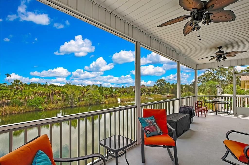 3276 Sea Grape Drive Hernando Beach, FL 34607 - Photo 33 of 55 a view of a chairs and table in patio