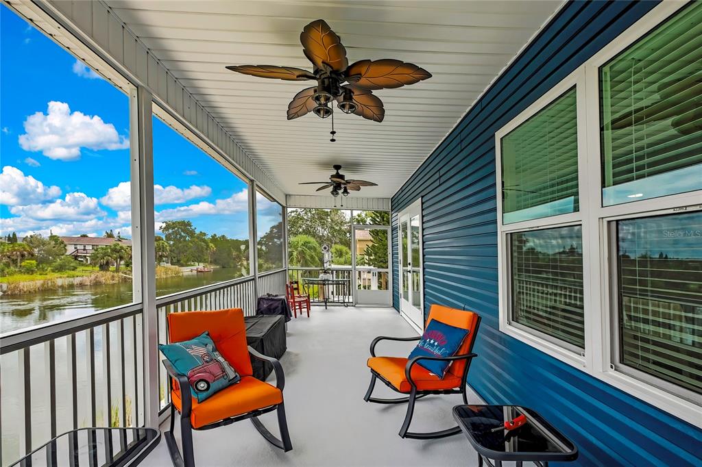 3276 Sea Grape Drive Hernando Beach, FL 34607 - Photo 34 of 55 a balcony with furniture and wooden floor