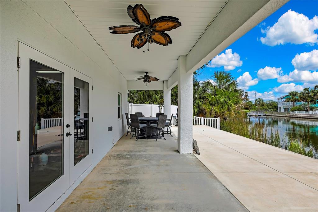 3276 Sea Grape Drive Hernando Beach, FL 34607 - Photo 38 of 55 a view of a patio with a tv