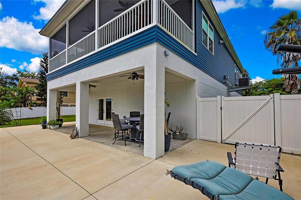 3276 Sea Grape Drive Hernando Beach, FL 34607 - Photo 39 of 55 a view of a patio with couches chairs and potted plants