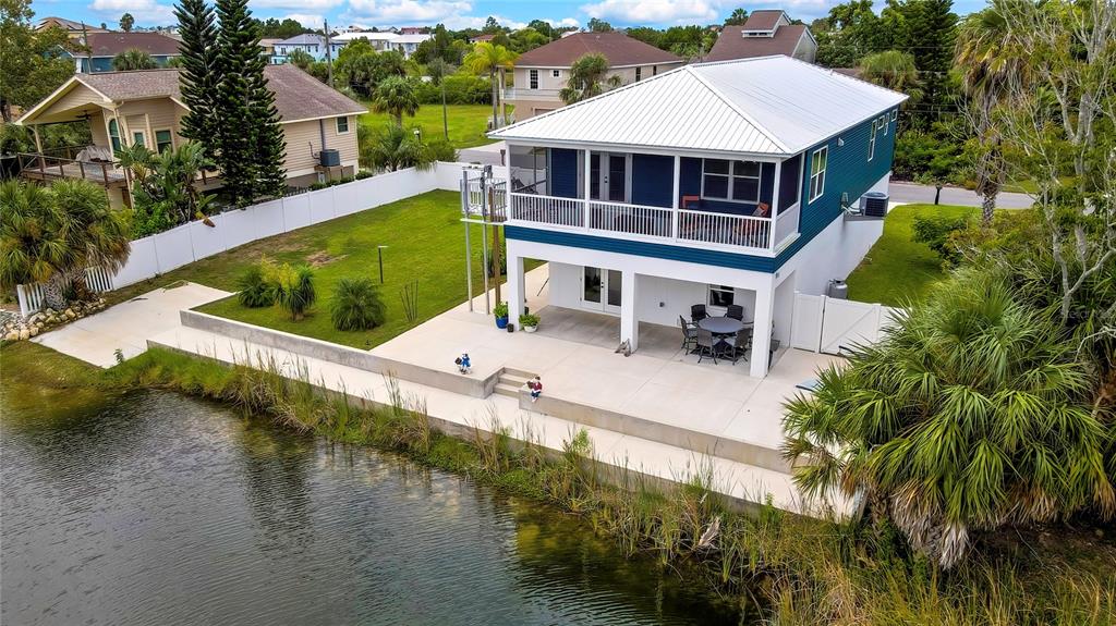 3276 Sea Grape Drive Hernando Beach, FL 34607 - Photo 6 of 55 a view of a house with pool and a yard