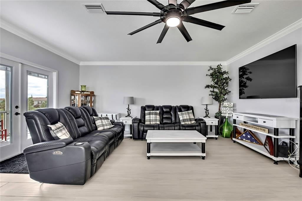 3276 Sea Grape Drive Hernando Beach, FL 34607 - Photo 8 of 55 a living room with furniture and a flat screen tv