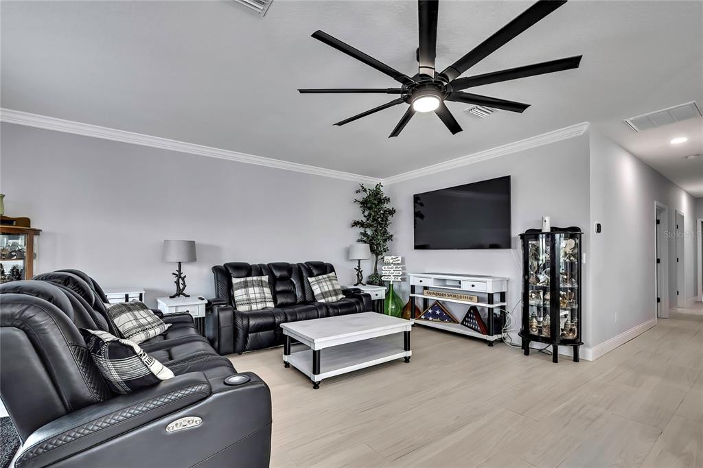 3276 Sea Grape Drive Hernando Beach, FL 34607 - Photo 9 of 55 a living room with furniture and a flat screen tv