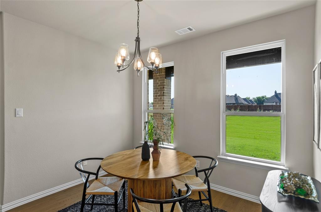 205 Stuart Paradise, TX 76073 - Photo 15 of 33 a view of a dining room with furniture window and outside view