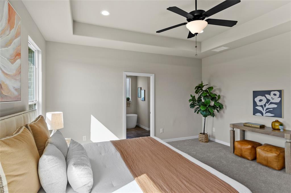 205 Stuart Paradise, TX 76073 - Photo 17 of 33 a bedroom with bed and a chandelier